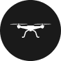 Icon of a white drone with four propellers on a black circular background, ideal for assisting land surveyors in Martin County.